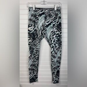 Nike woman’s Leg-A-See Windblur leggings. White, black, teal, pink. Size M.